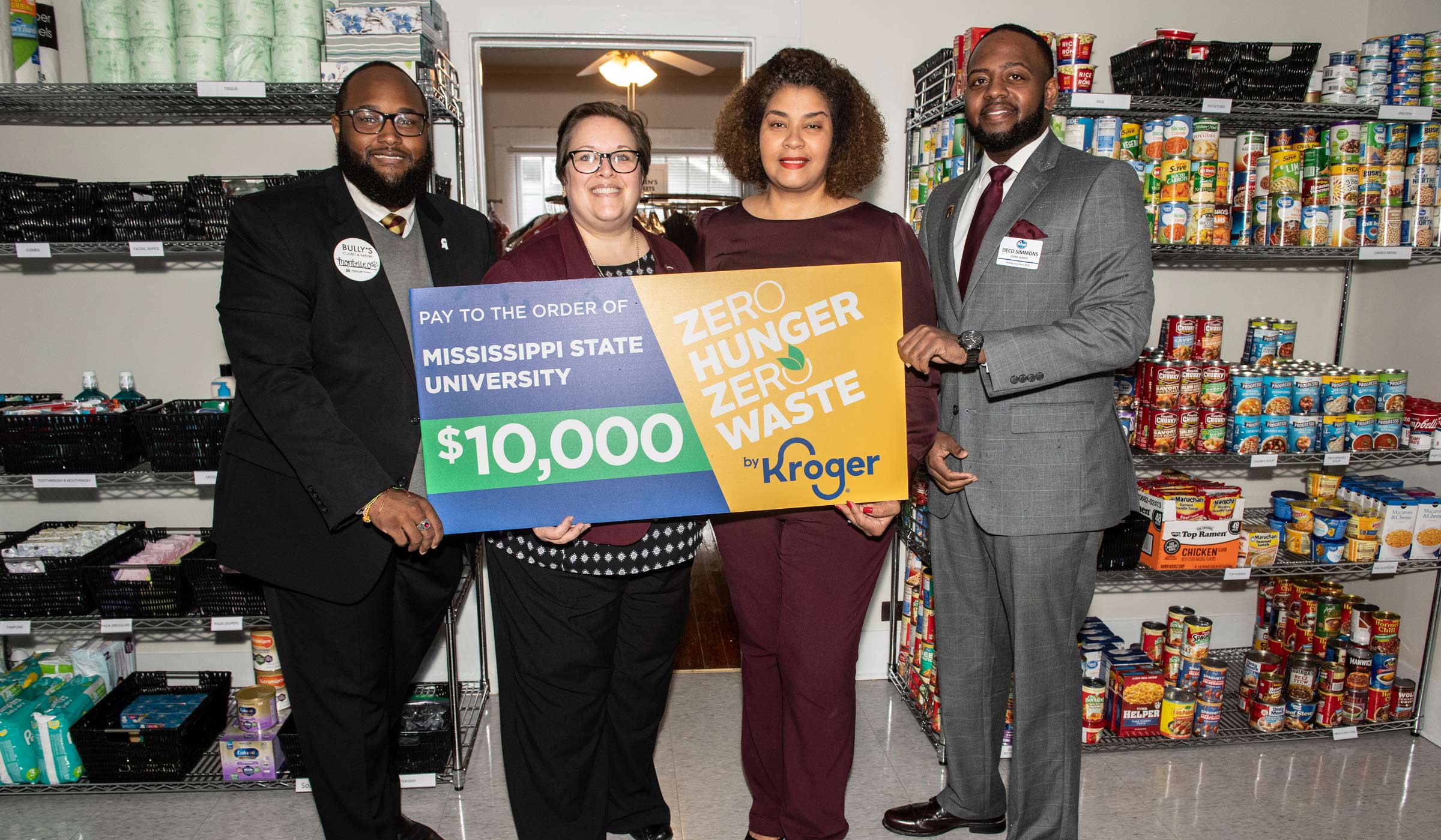 MSU and Kroger Representatives pose with a check donation to Bully's Closet.