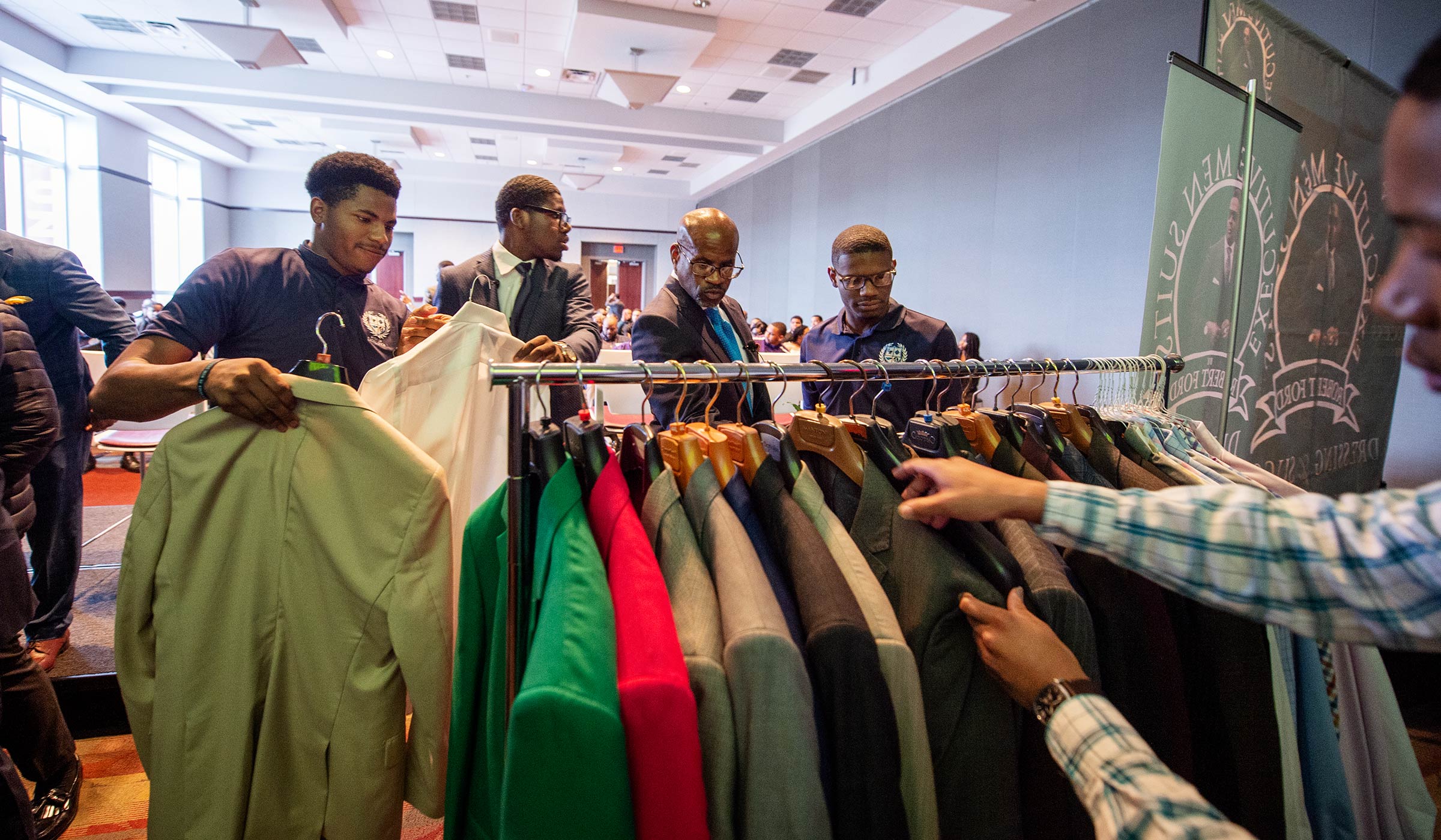As part of the "Dress for Success" segment, MSU students pick through a rack of suits to find interview-appropriate attire.