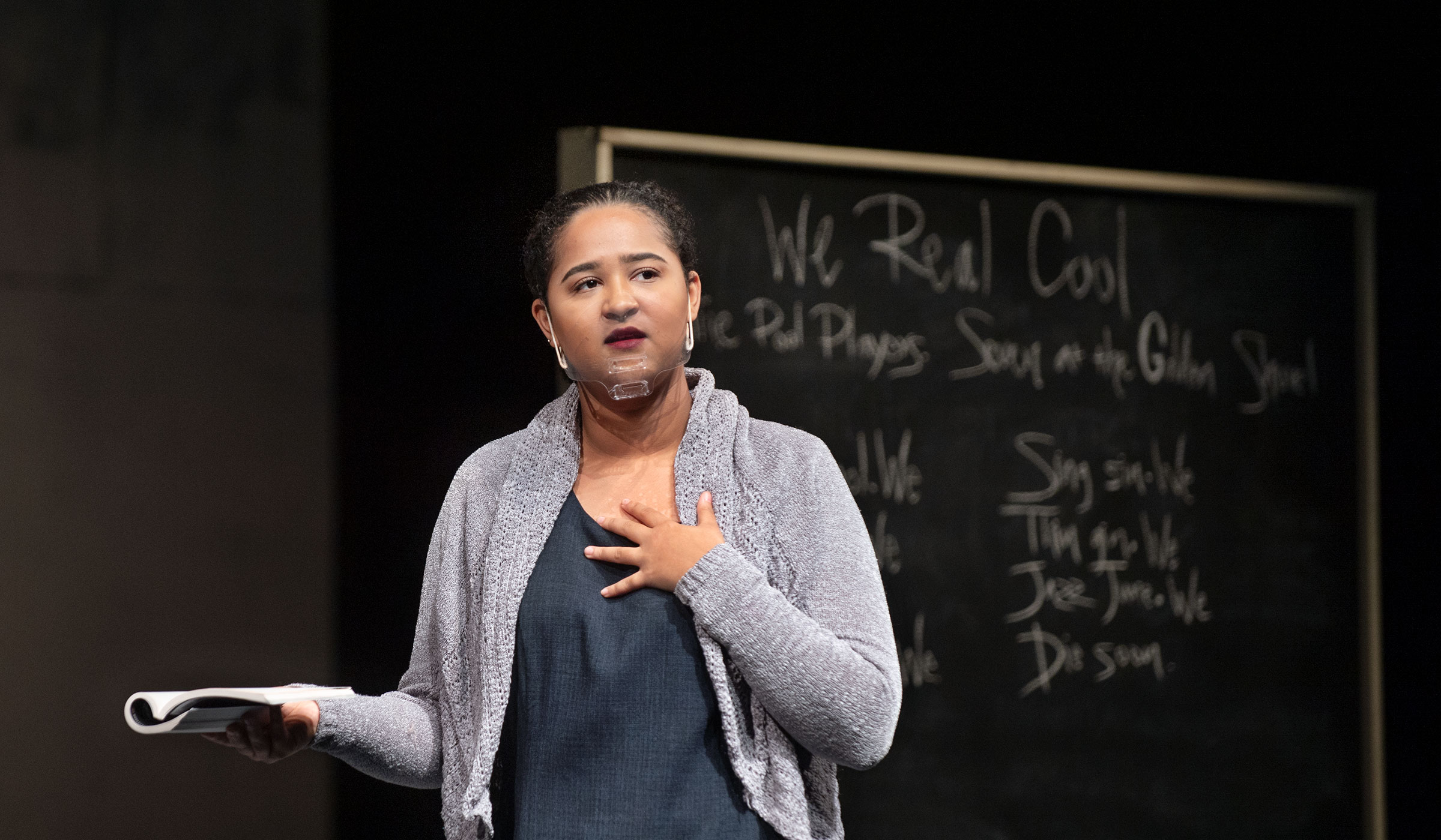 Theatre MSU student actress Preslie Cowley plays the lead character, Nye, teaching in front of a blackboard in the play "Pipeline."