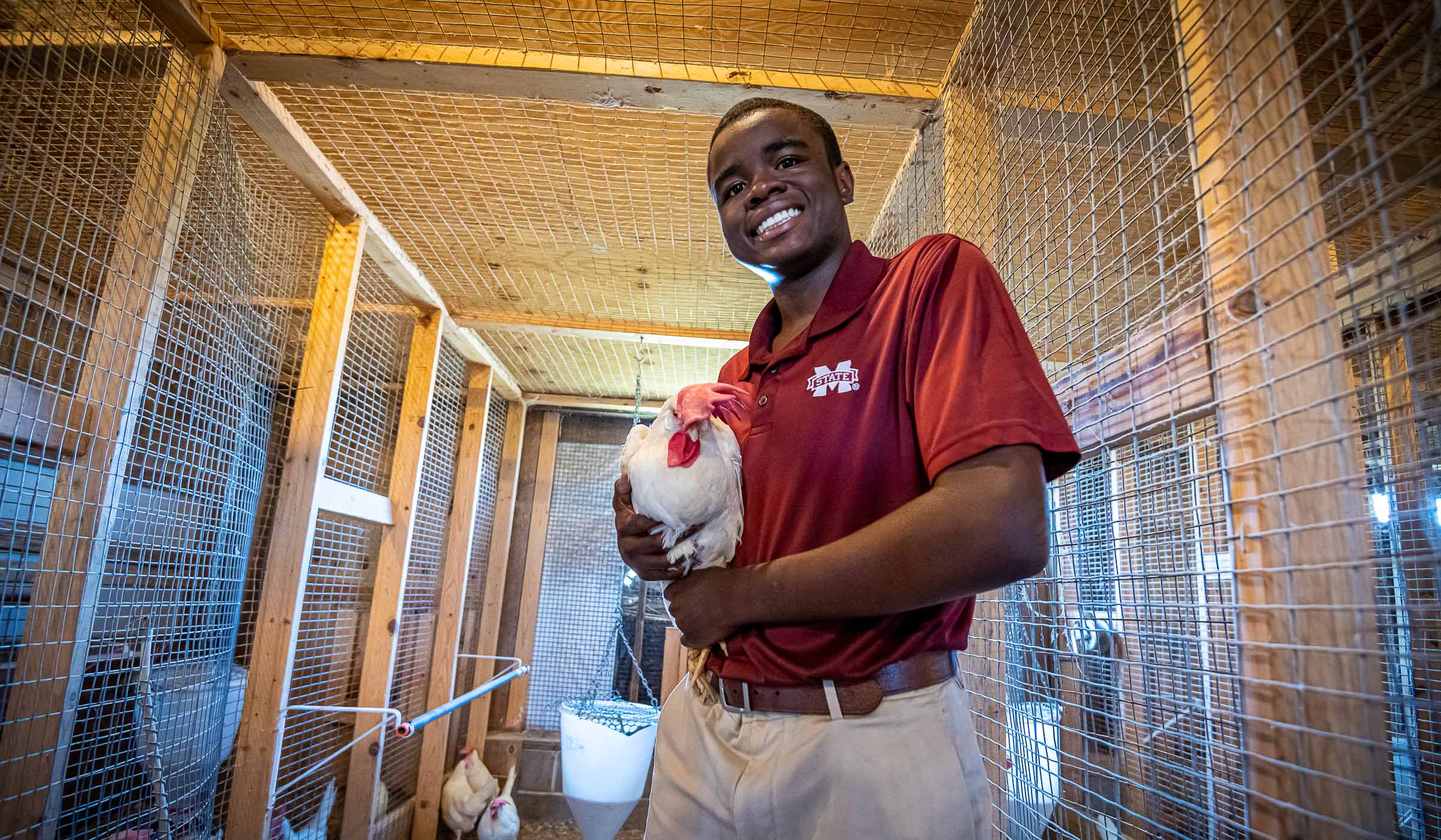 Rodney Self, pictured holding a chicken.