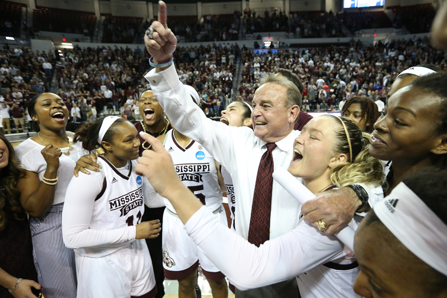 Women's Basketball coach and team celebrating advancing to the Sweet 16 of NCAA Tournament