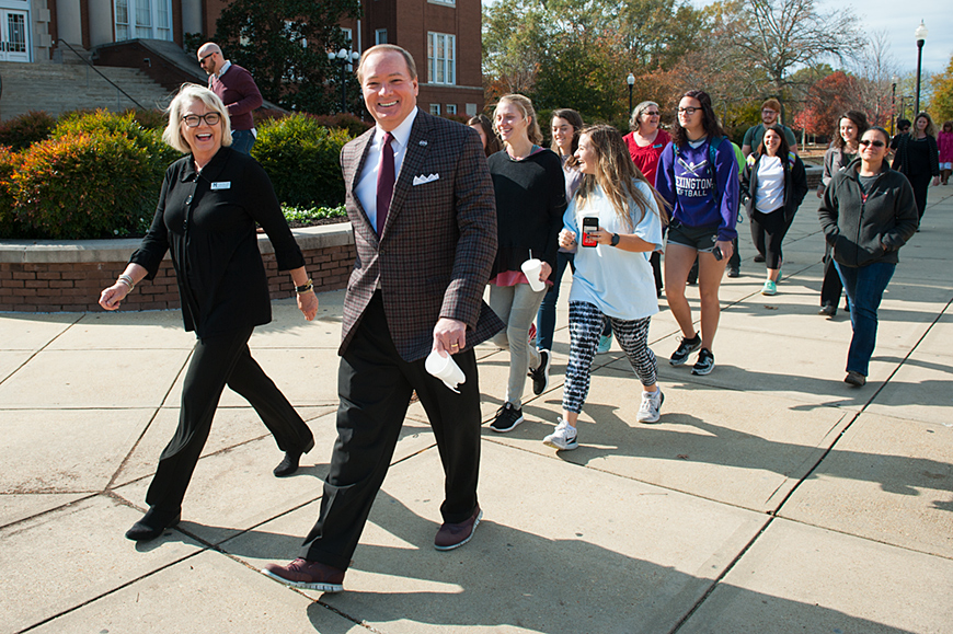 SU President Mark E. Keenum joins a "Celebrity Walk" around the Drill Field with MSU students and Director of Health Promotion and Wellness Joyce Yates