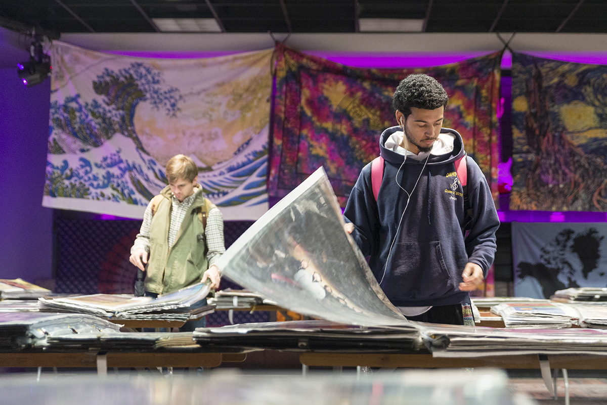 Two students browse books of posters in MSU's Colvard Student Union.