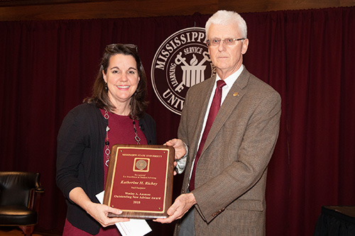 Katherine Richey, staff recipient of the Wesley A. Ammon Outstanding New Academic Advisor Award, is pictured with Peter Ryan, MSU associate provost for academic affairs. Peter Ryan, MSU associate provost for academic affairs, congratulates Katherine Richey, staff recipient of the Wesley A. Ammon Outstanding New Advisor Award. (Photo by Beth Wynn)