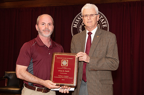 Brian K. Smith, faculty recipient of the Wesley A. Ammon Outstanding New Academic Advisor Award, is pictured with Peter Ryan, MSU associate provost for academic affairs. Peter Ryan, MSU associate provost for academic affairs, congratulates Brian K. Smith, faculty recipient of the Wesley A. Ammon Outstanding New Advisor Award. (Photo by Beth Wynn)